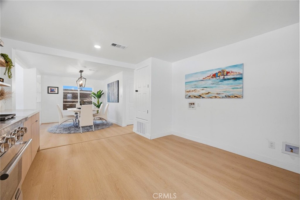 1280 East Woodbury Road Pasadena, CA 91104 - Photo 21 of 40 a view of a livingroom with wooden floor and furniture