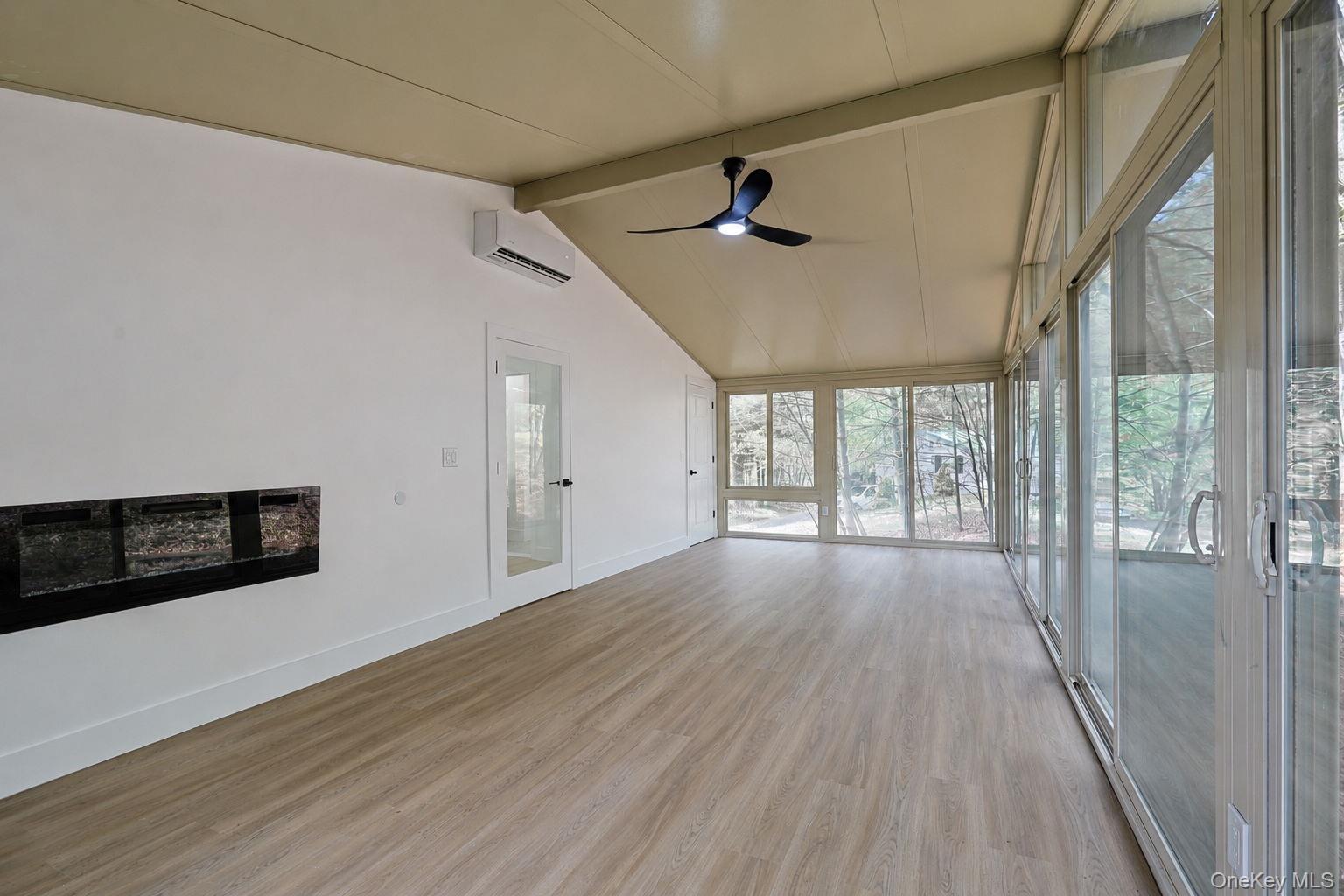 25 Overlook Road Woodbourne, NY 12788 - Photo 16 of 22 a view of empty room with wooden floor and fan