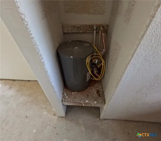 a view of storage and utility room with empty racks