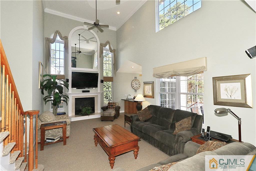 1 Conor Road Jackson, NJ 08527 - Photo 11 of 25 a living room with furniture a large window and a fireplace
