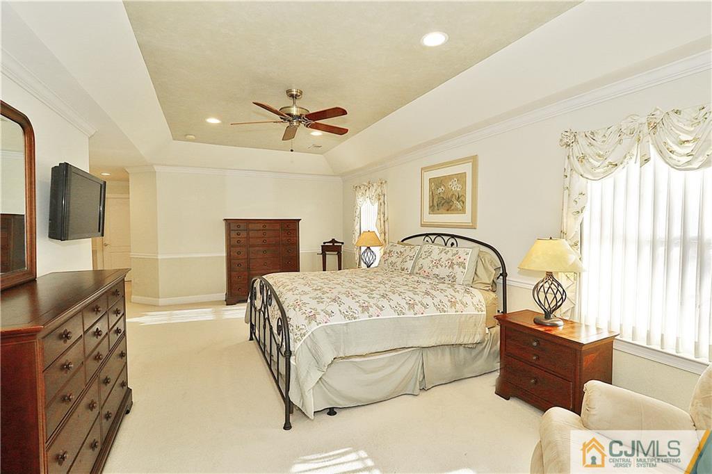 1 Conor Road Jackson, NJ 08527 - Photo 16 of 25 a bedroom with a bed and a flat screen television