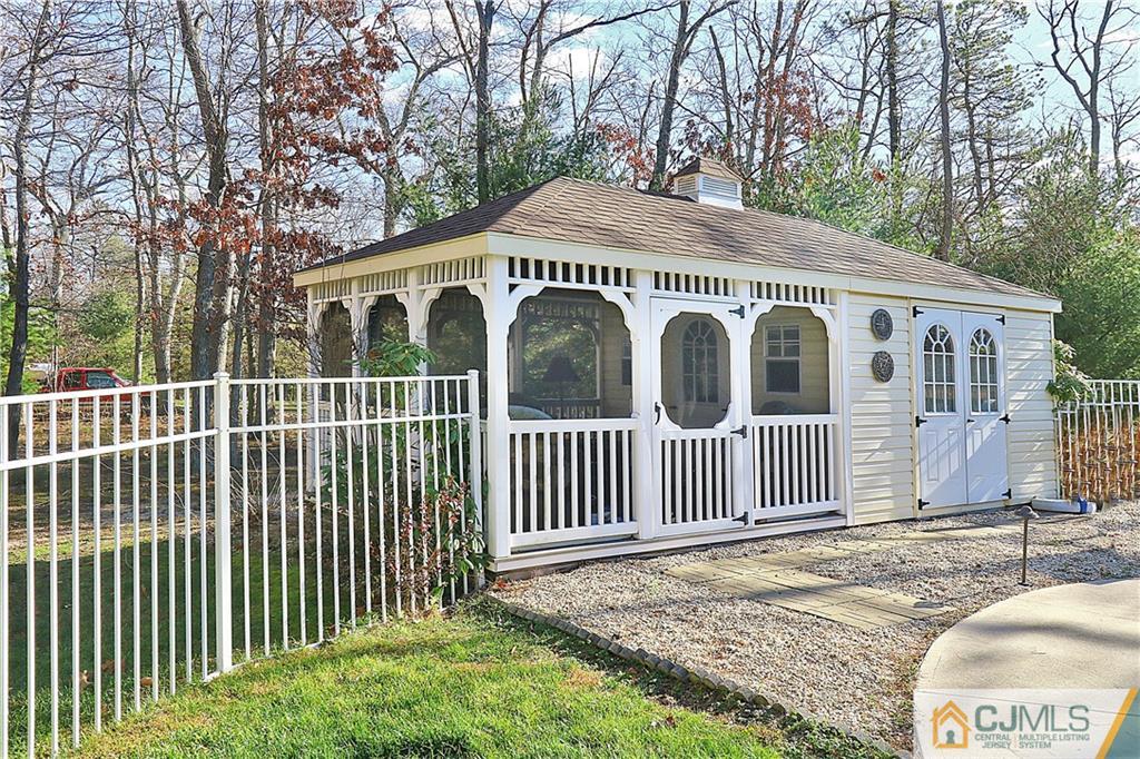 1 Conor Road Jackson, NJ 08527 - Photo 22 of 25 a view of a house with a small yard and wooden fence