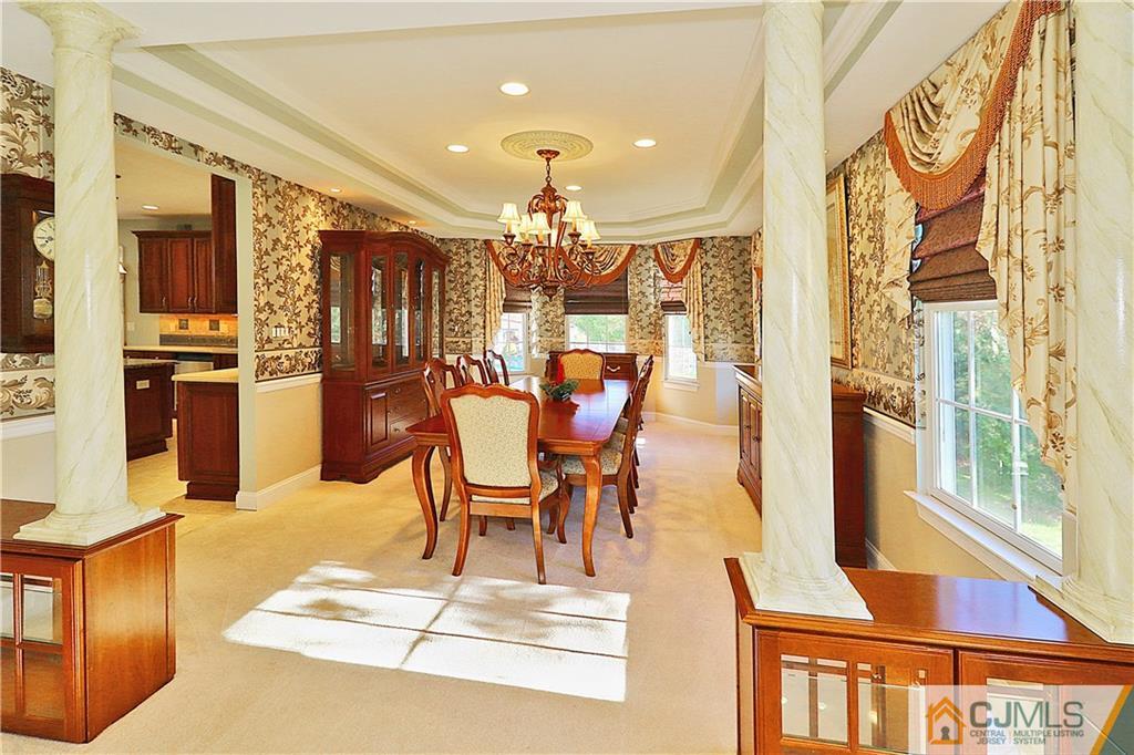 1 Conor Road Jackson, NJ 08527 - Photo 6 of 25 a dining room with furniture a chandelier and wooden floor