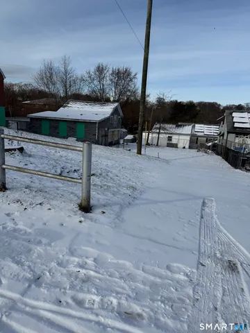 a view of a backyard with sitting area
