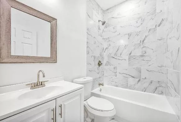 a bathroom with a sink a toilet and a bathtub