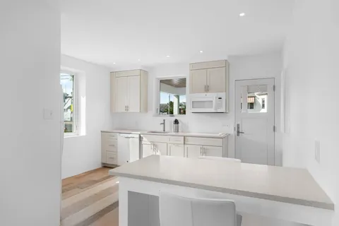 a aerial view of a house with a yard