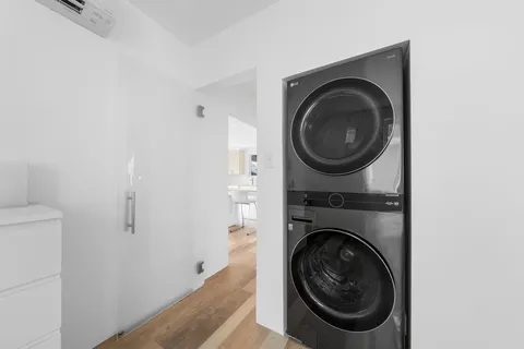 a bathroom with a bathtub and shower