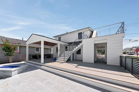 a view of deck with wooden floor and iron fence