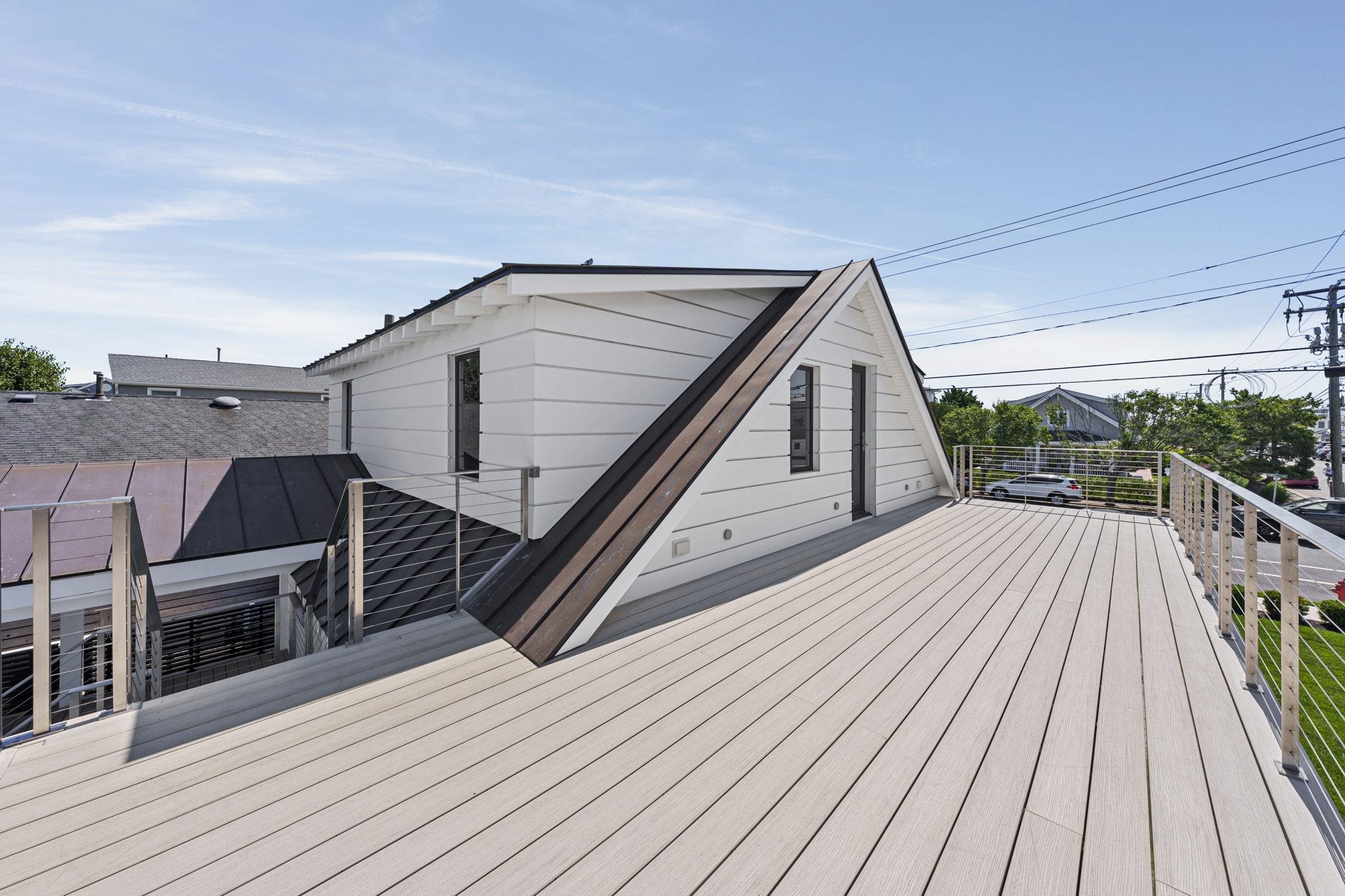2988 1st Avalon, NJ 08202 - Photo 9 of 30 a view of deck with wooden floor and iron fence