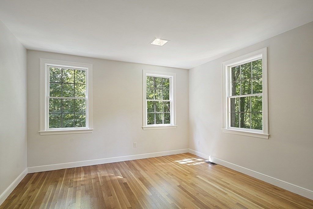 35 Drum Hill Road Concord, MA 01742 - Photo 24 of 35 a view of an empty room with wooden floor and a window