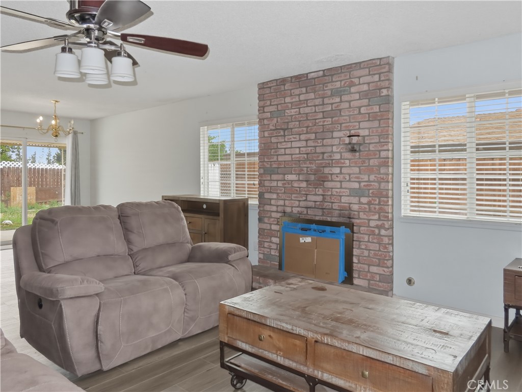 4409 Challen Avenue Riverside, CA 92503 - Photo 5 of 31 a living room with furniture and a fireplace