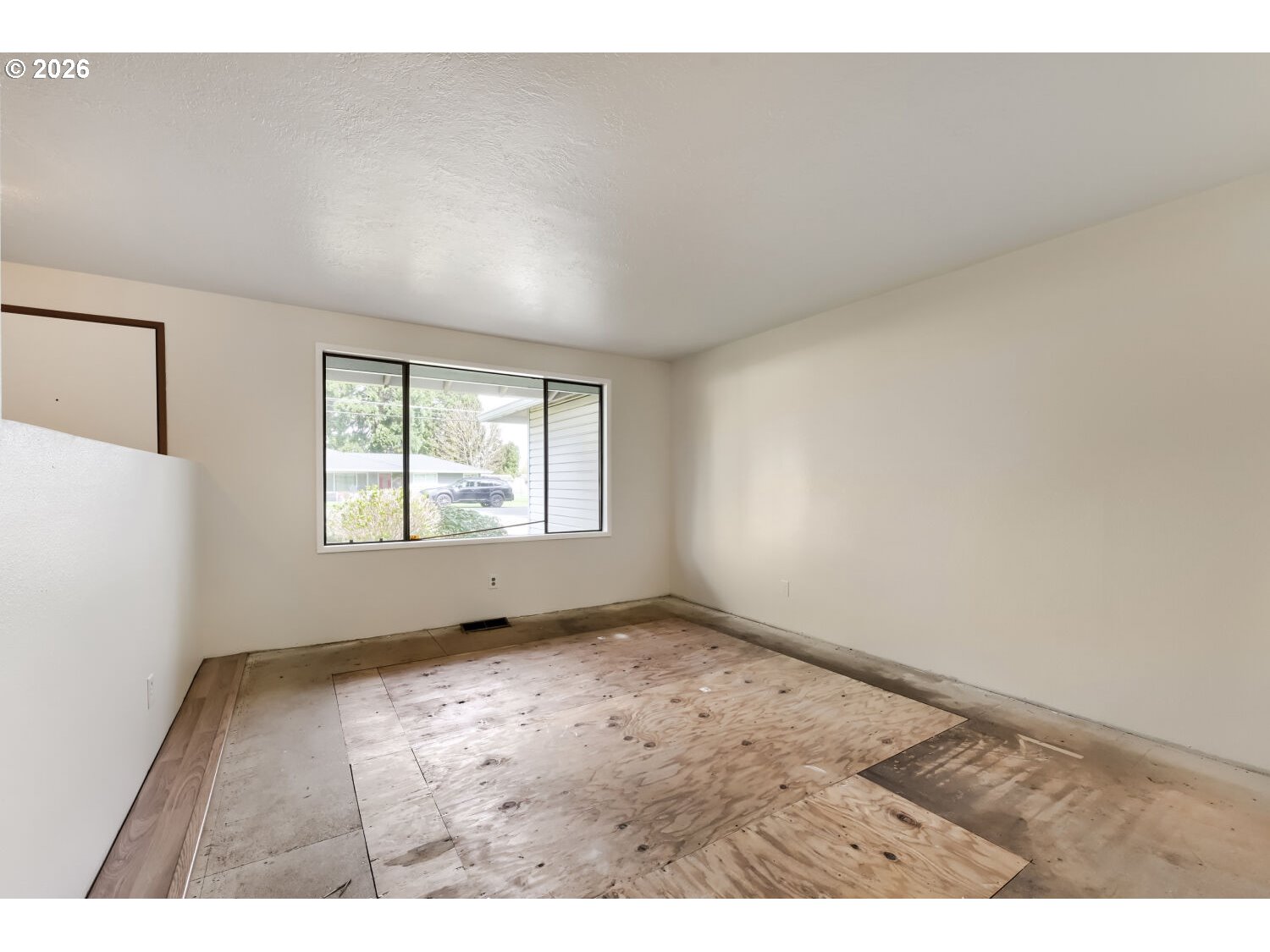 19710 Southwest Johnson Street Beaverton, OR 97003 - Photo 7 of 15 a view of an empty room with a window