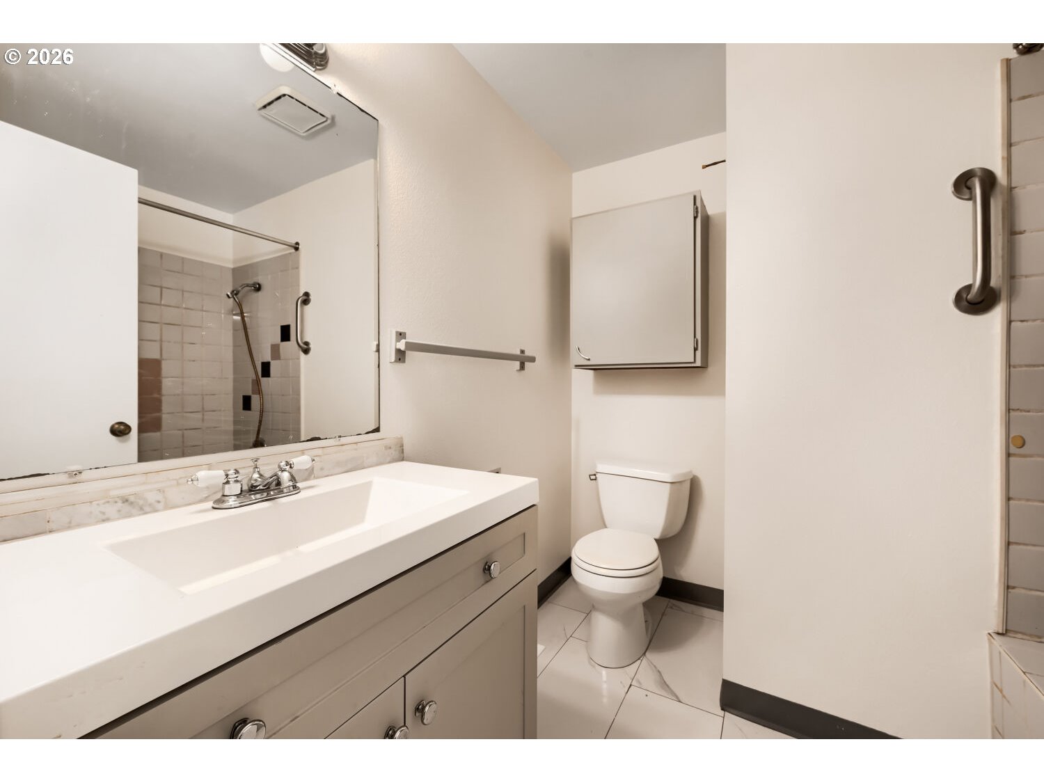 19710 Southwest Johnson Street Beaverton, OR 97003 - Photo 8 of 15 a bathroom with a sink a toilet and mirror