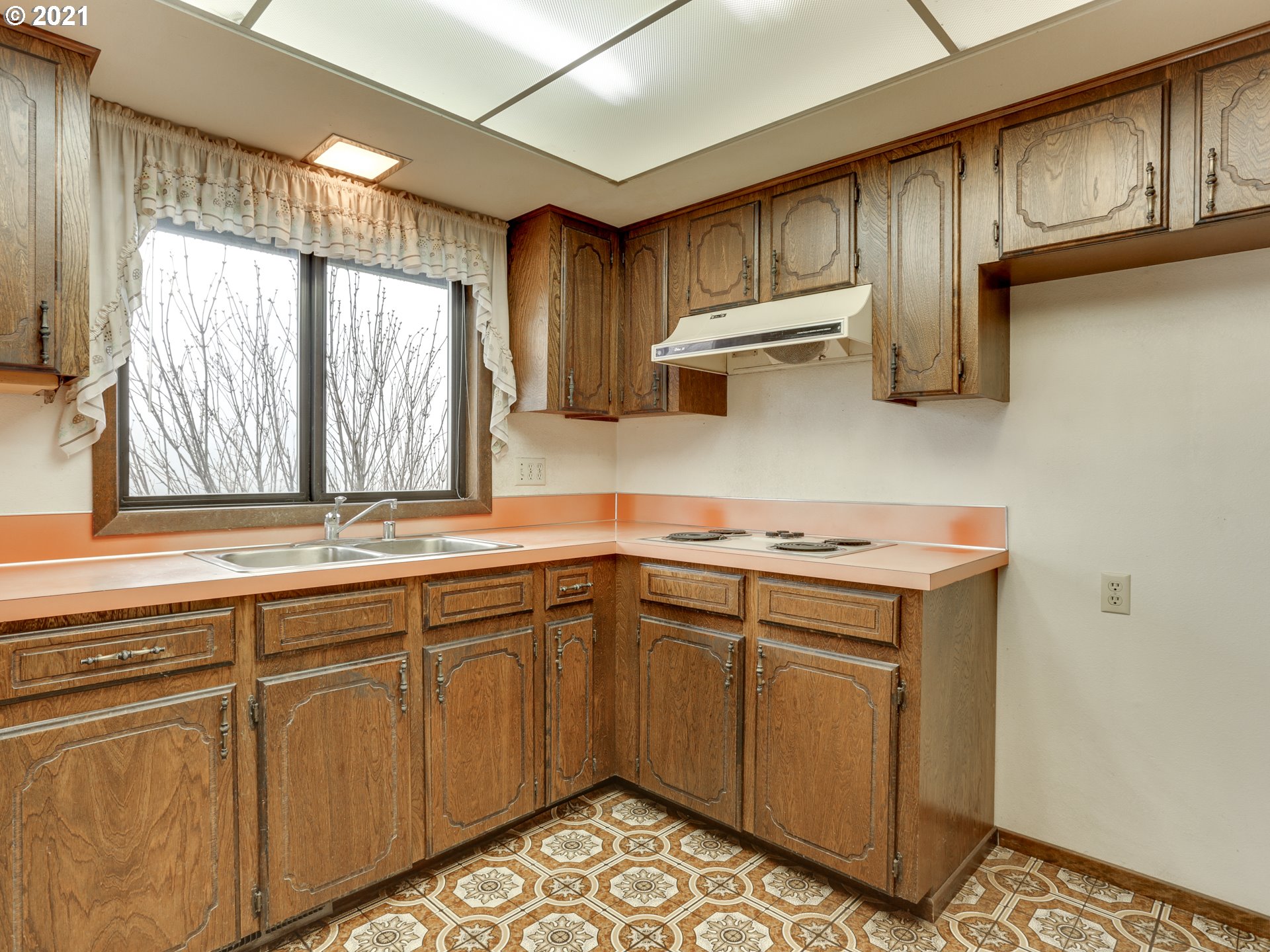 3422 South 31st Way Ridgefield, WA 98642 - Photo 14 of 32 a kitchen with a sink cabinets and window