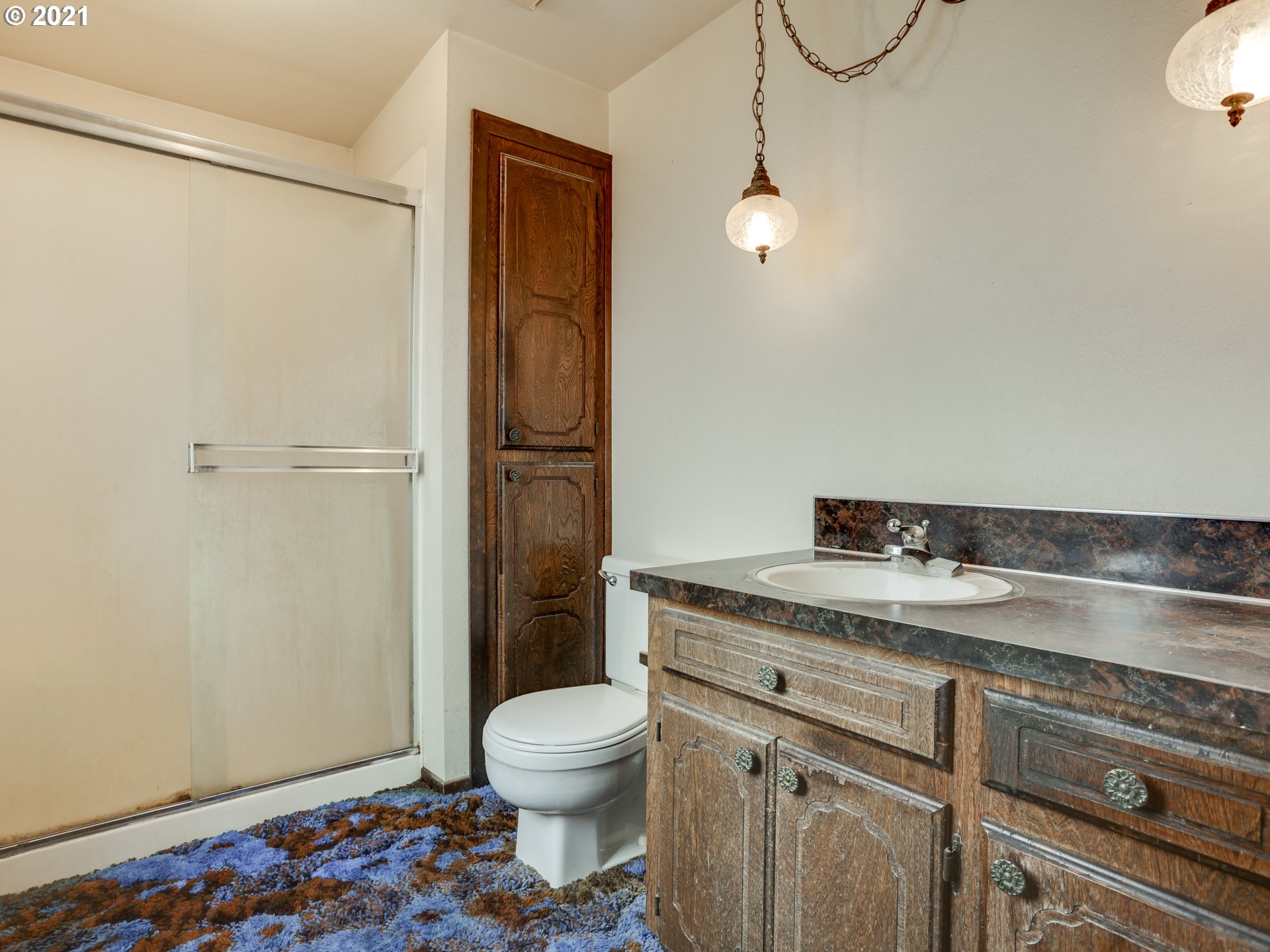 3422 South 31st Way Ridgefield, WA 98642 - Photo 26 of 32 a bathroom with a granite countertop sink toilet and shower