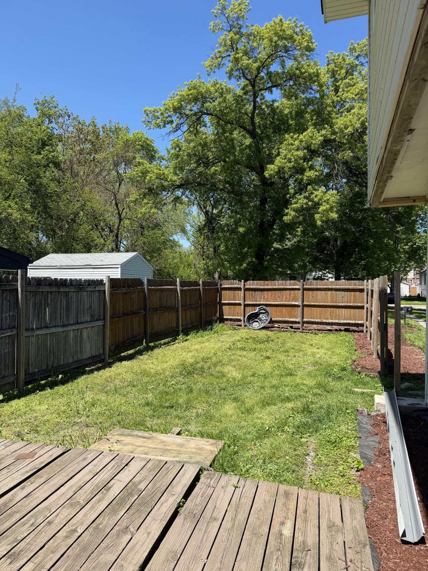426 Cherry Street Hammond, IN 46324 - Photo 6 of 6 a view of backyard with wooden fence