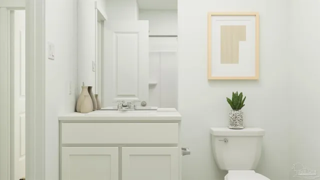 a bedroom with a bed mirror and a window