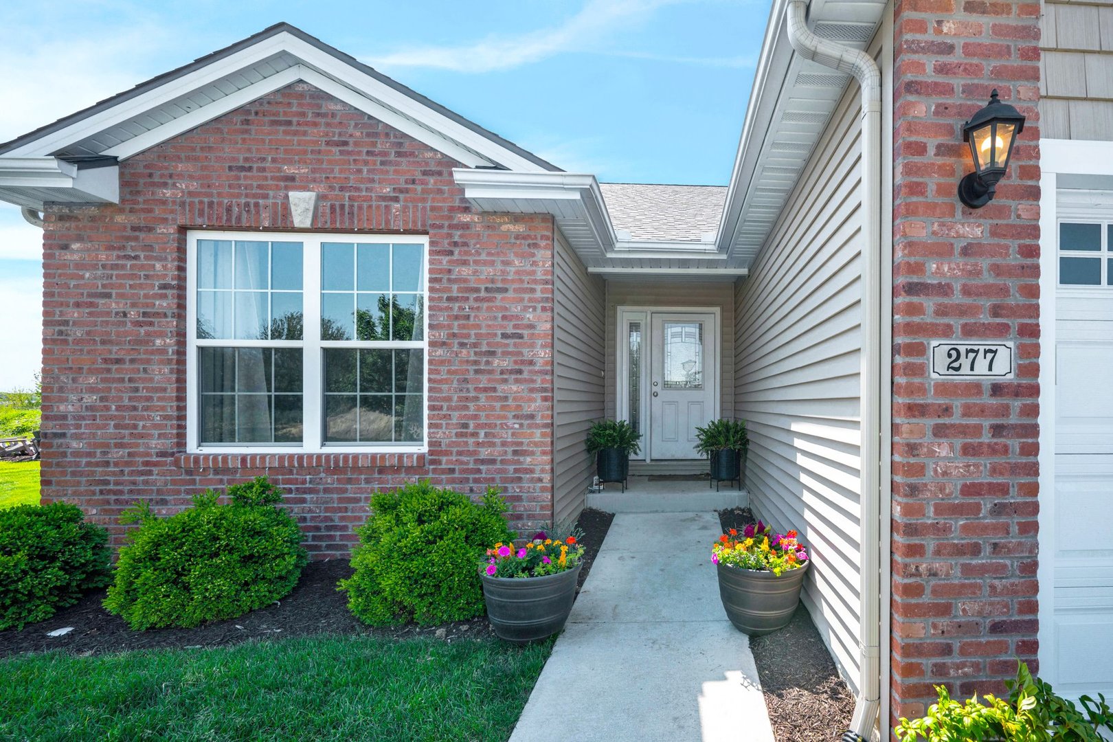 277 Cassidy Road Normal, IL 61761 - Photo 2 of 42 a front view of a house with garden