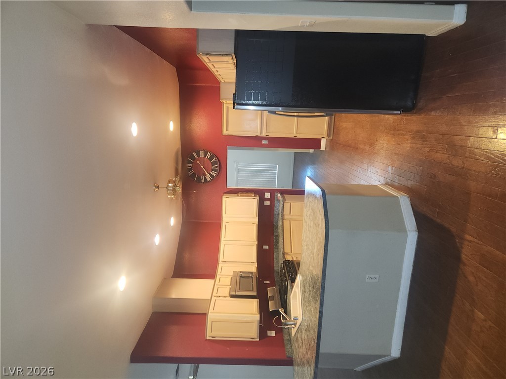 564 Ridgeway Road Henderson, NV 89015 - Photo 7 of 22 An inviting kitchen with rich wood flooring and granite countertops awaits your culinary touch.
