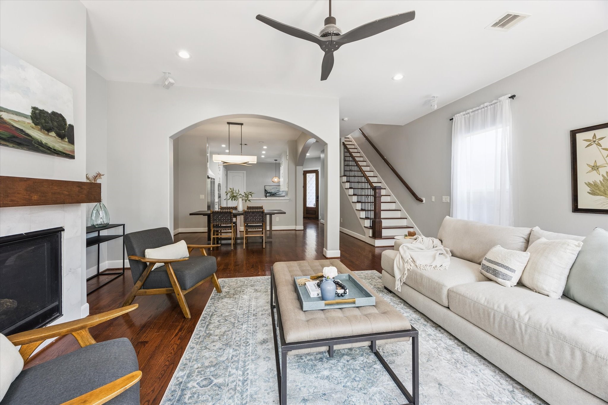 1540 Lawrence Street Houston, TX 77008 - Photo 3 of 26 A view of the living room looking back towards the dining room and kitchen. (Previous home staging)
