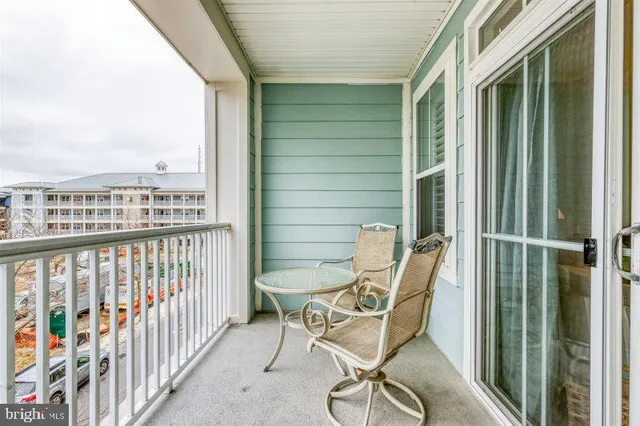 a view of a balcony with chairs