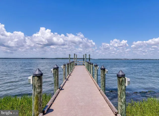 a view of a balcony with wooden fence