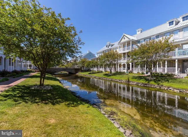 a view of a lake with a building in the background