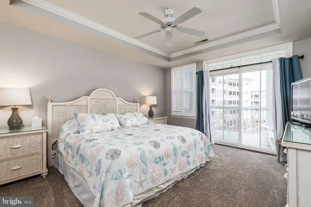 a bedroom with a large bed and a tv