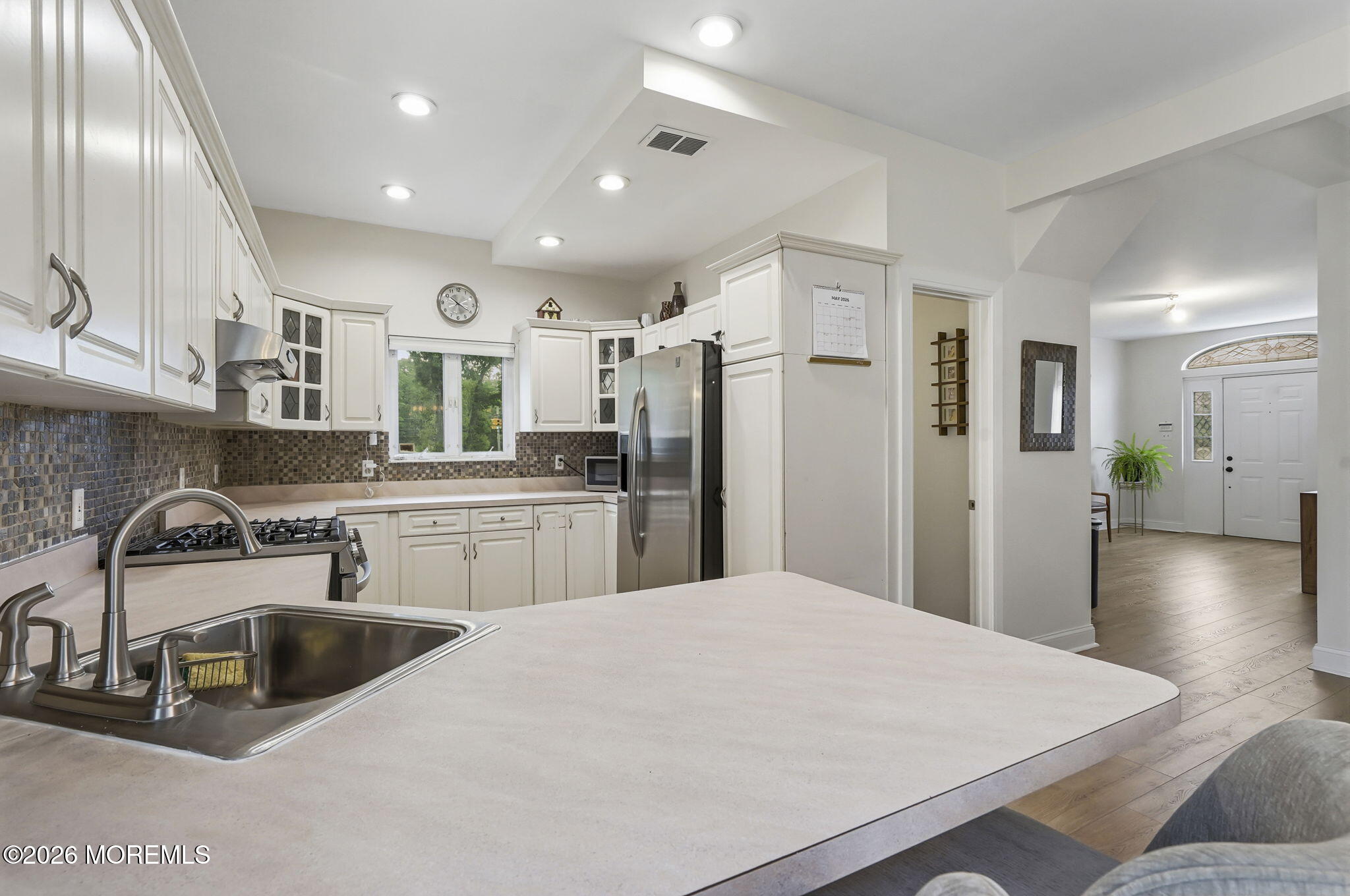 438 Bennetts Mills Road Jackson, NJ 08527 - Photo 11 of 42 a kitchen with stainless steel appliances a sink a refrigerator a stove a microwave and island
