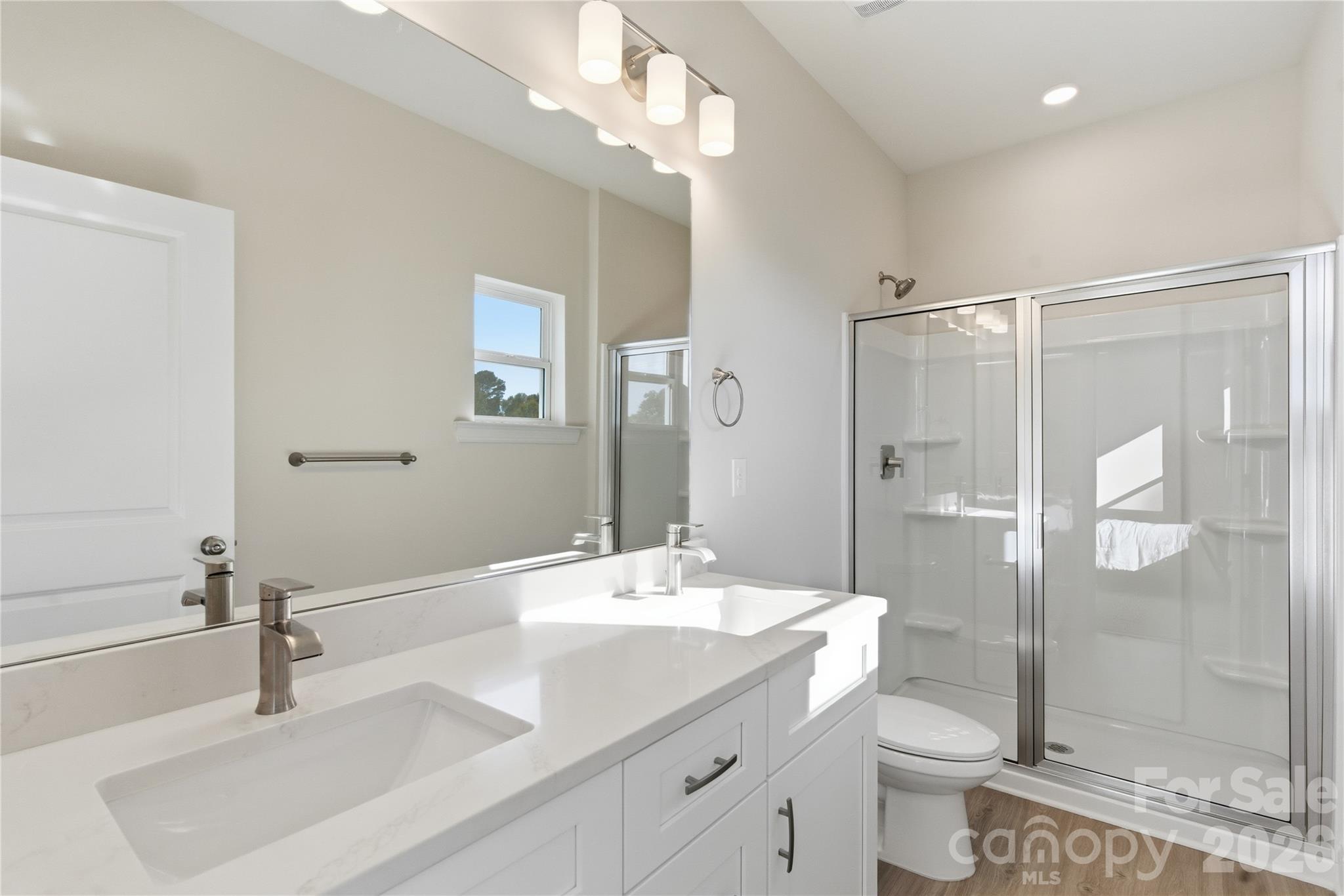 230 1st Street South Fort Mill, SC 29708 - Photo 15 of 22 a bathroom with a double vanity sink toilet and shower