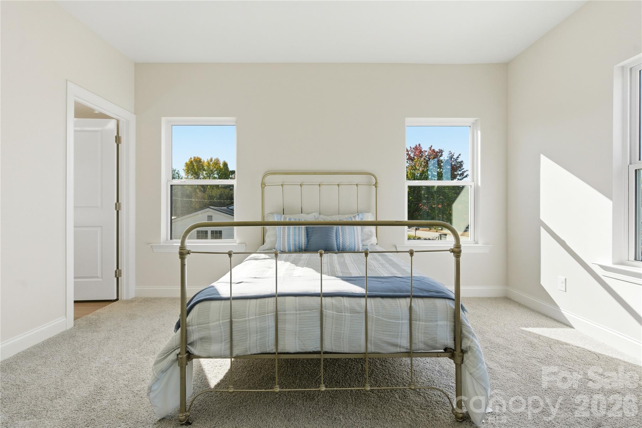 230 1st Street South Fort Mill, SC 29708 - Photo 17 of 22 a bedroom with a bed and a table in it