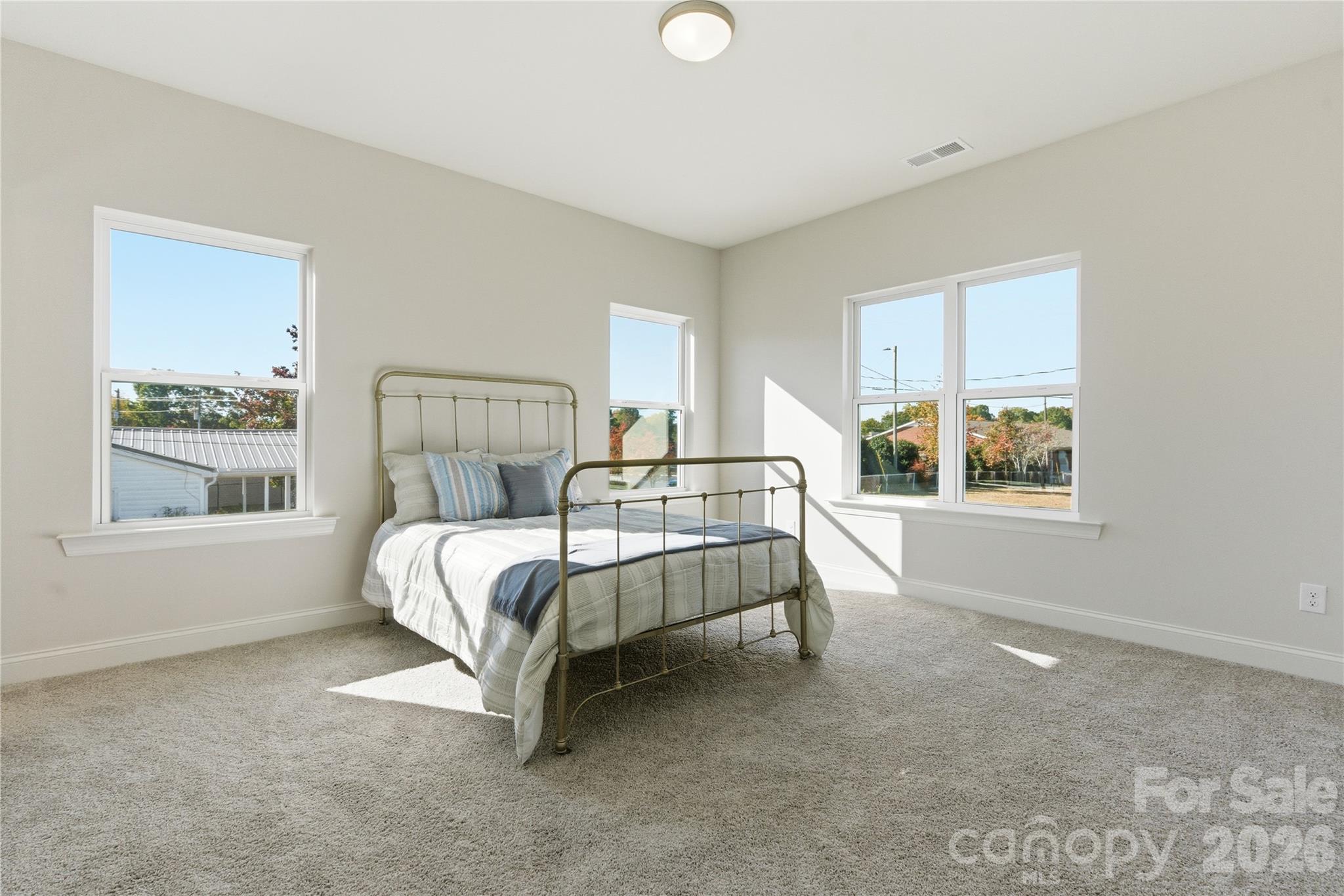 230 1st Street South Fort Mill, SC 29708 - Photo 20 of 22 a bed sitting in a bedroom next to a window