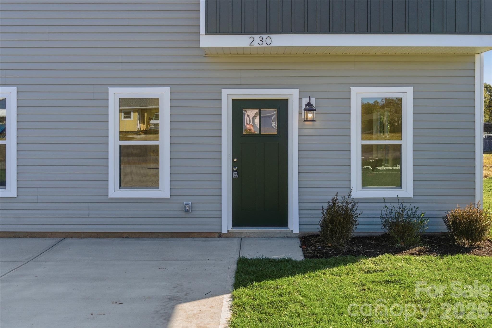 230 1st Street South Fort Mill, SC 29708 - Photo 21 of 22 a front view of a house with a yard