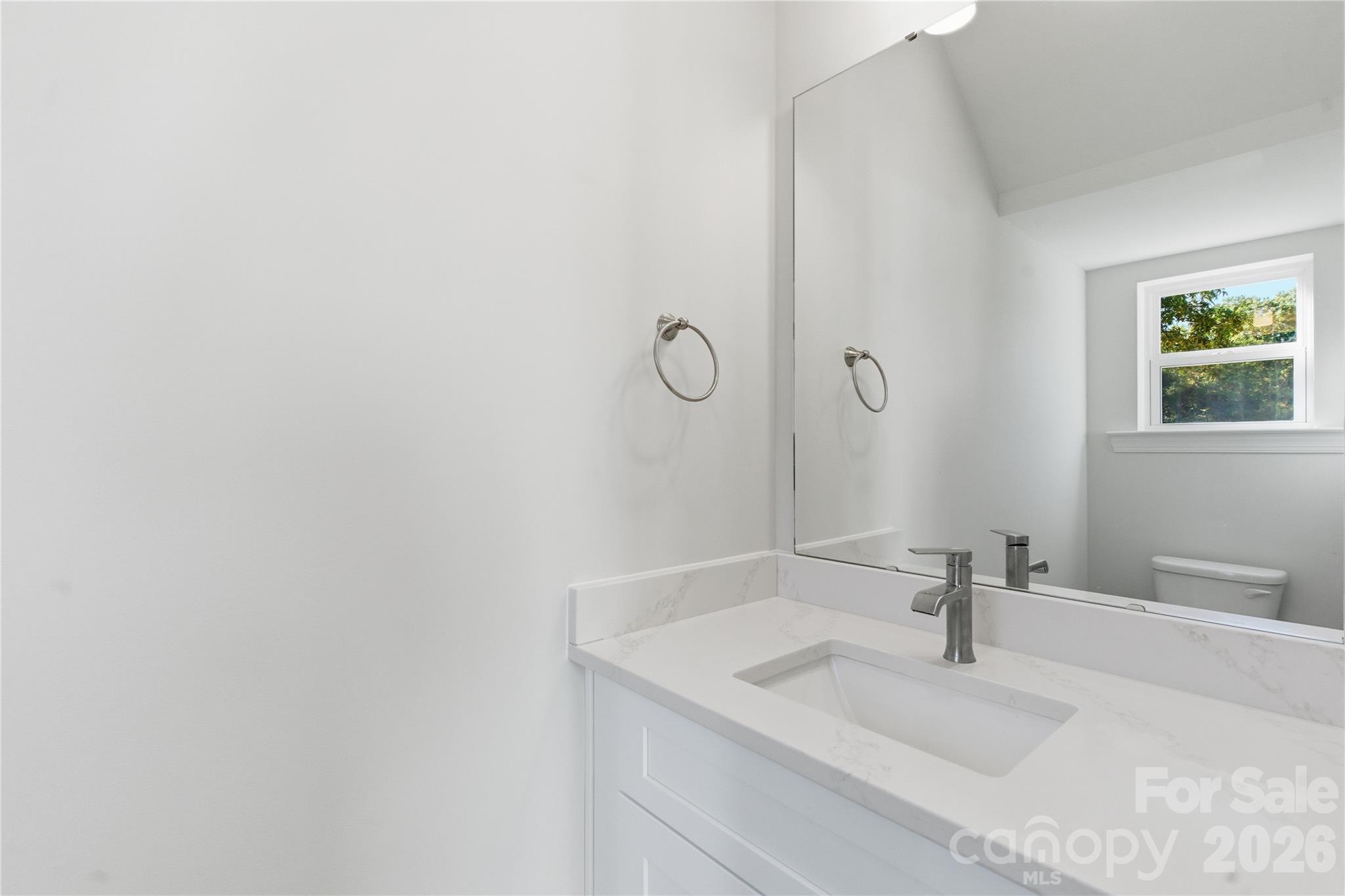 230 1st Street South Fort Mill, SC 29708 - Photo 5 of 22 a bathroom with a granite countertop sink and a mirror