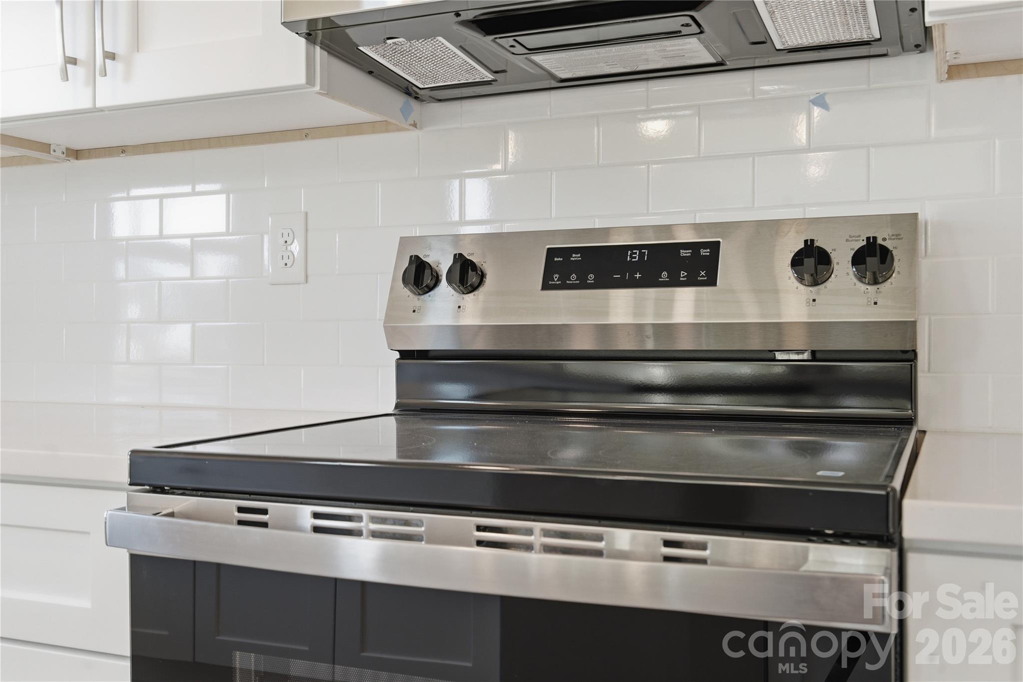230 1st Street South Fort Mill, SC 29708 - Photo 7 of 22 a stove top oven sitting inside of a kitchen