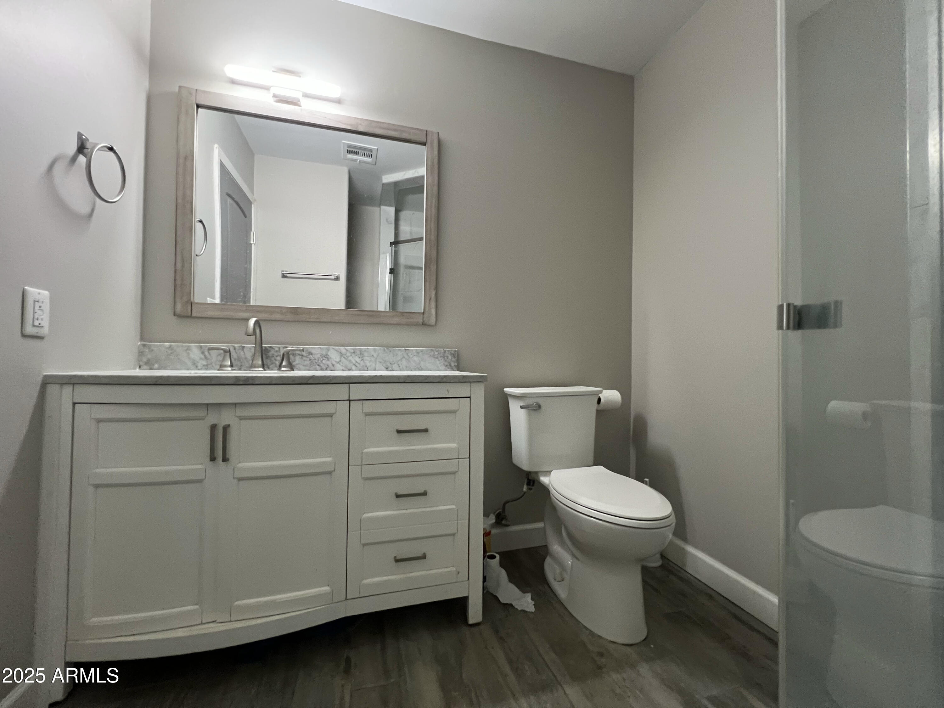 8201 South 26th Street Phoenix, AZ 85042 - Photo 14 of 42 a bathroom with a toilet sink and mirror
