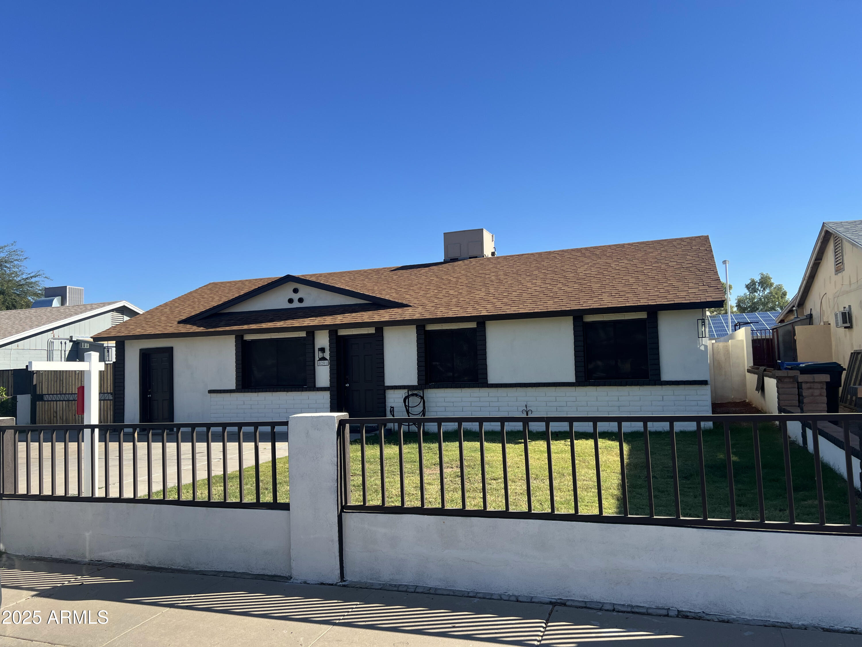 8201 South 26th Street Phoenix, AZ 85042 - Photo 2 of 42 a front view of a house
