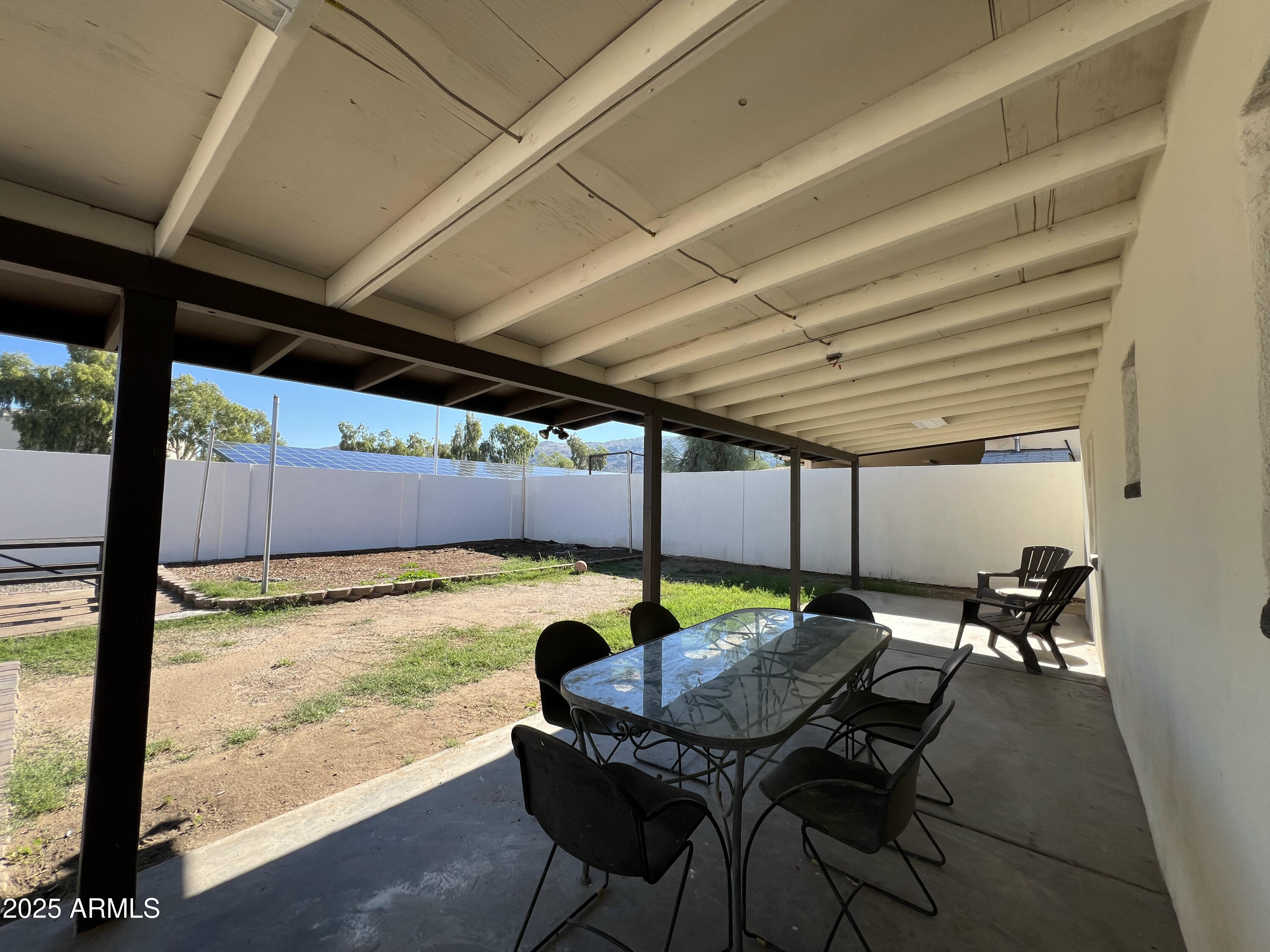 8201 South 26th Street Phoenix, AZ 85042 - Photo 30 of 42 a patio with table and chairs with the view of swimming pool