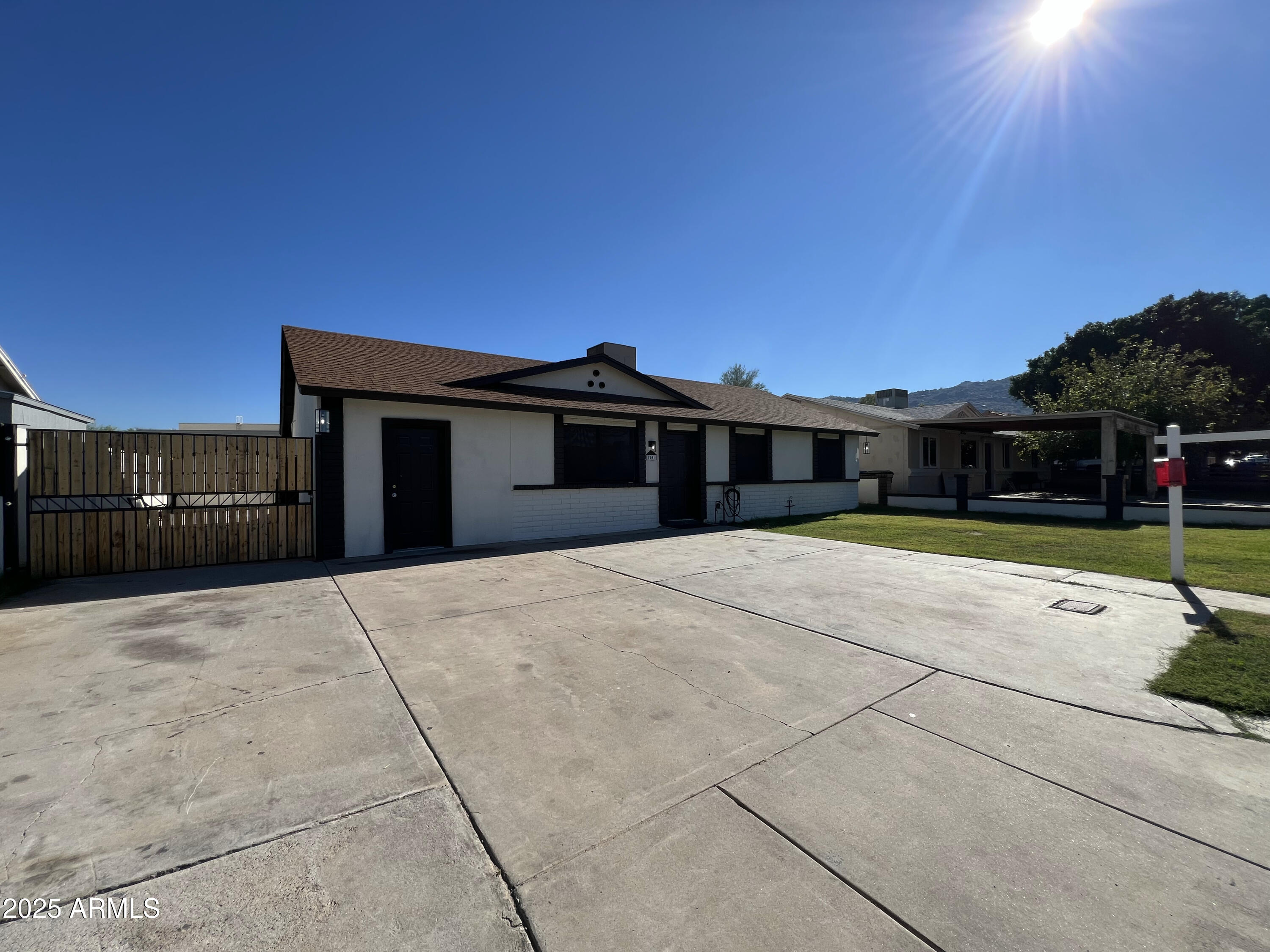 8201 South 26th Street Phoenix, AZ 85042 - Photo 42 of 42 a view of house with yard