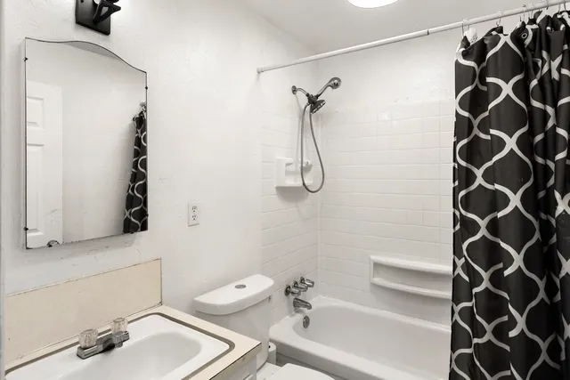 a bathroom with a sink and a bathtub