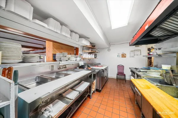 a living room with furniture a flat screen tv and a window