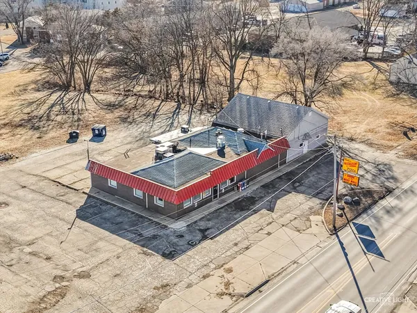 a wooden bench sitting in the middle of a yard