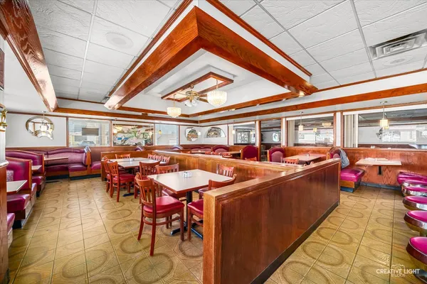 a kitchen with a stove and a refrigerator