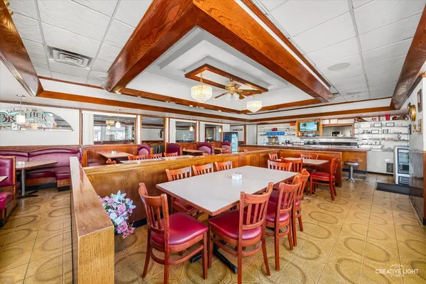 a kitchen with stainless steel appliances kitchen island granite countertop a sink and cabinets