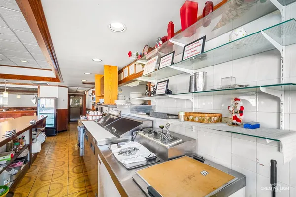 a kitchen with stainless steel appliances granite countertop a stove and a sink