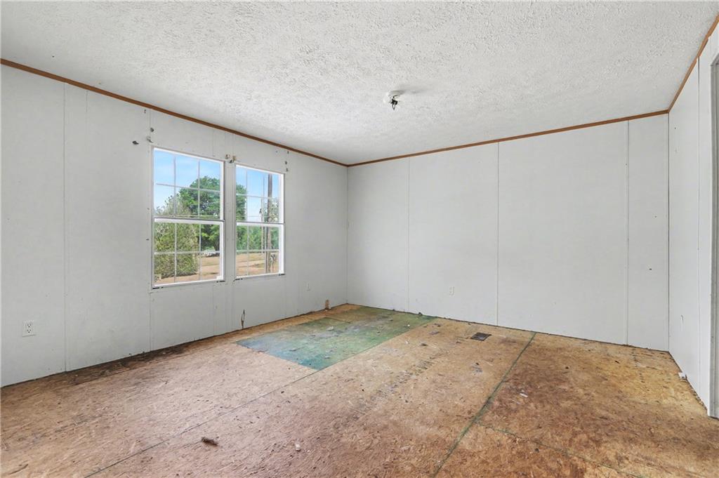 249 John Golden Road Temple, GA 30179 - Photo 26 of 45 an empty room with a window
