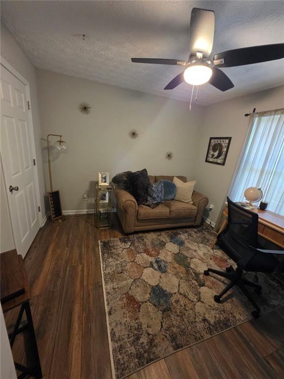 6102 Fairington Ridge Circle Lithonia, GA 30038 - Photo 18 of 22 a living room with furniture and a rug