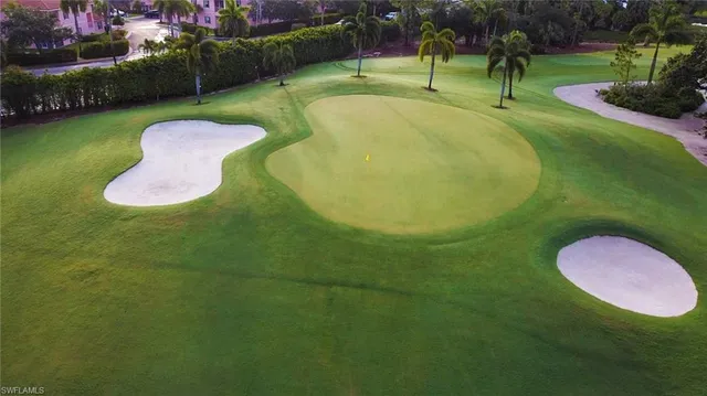 a view of a golf course with a swimming pool