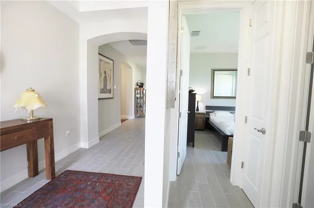 a view of a bedroom from a hallway