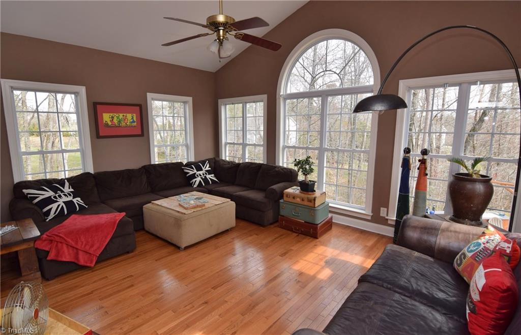 704 Number Ten Way Oak Ridge, NC 27310 - Photo 12 of 30 This wonderful sunroom is the perfect place to enjoy your morning coffee in any season!